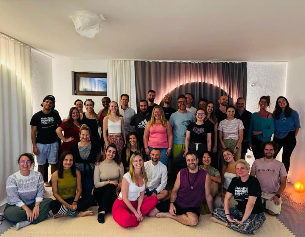 A full Identity Installation room in Bansko, the whole cohort together and smiling at the camera.